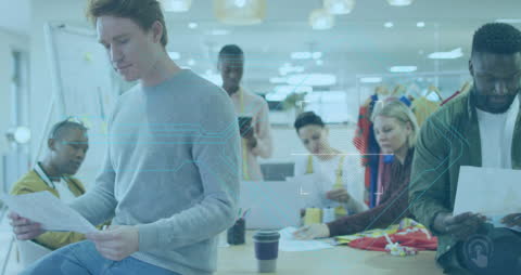 Diverse Team Collaborates in Modern Office Highlighting Security and Teamwork