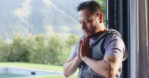 Senior Man Meditating with Peaceful Mountain View Outdoors
