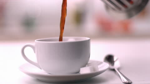 Pouring Coffee into Ceramic Cup in Slow Motion