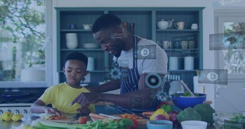 Dad and son preparing healthy meal using augmented reality cooking assistant in kitchen