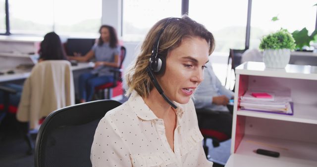 Female Customer Service Representative Working in Modern Office - Download Free Stock Images Pikwizard.com