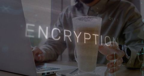 Freelancer working on laptop at cafe with encryption overlay and frothy latte