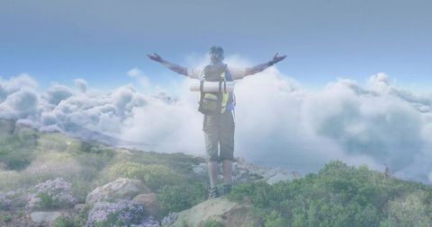 Hiker Embracing Mountain Top Clouds During Solo Adventure