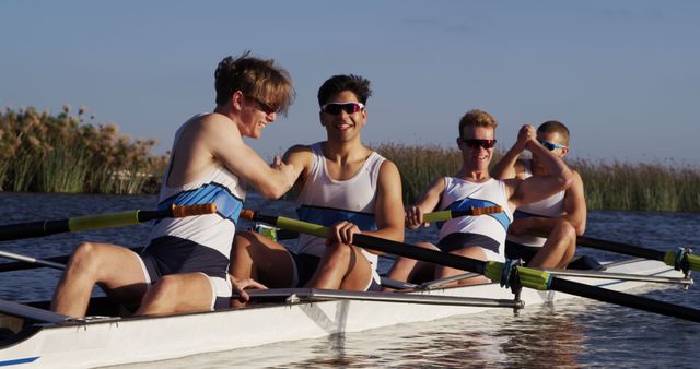 Team of Rowers Celebrating Victory on Calm Lake - Download Free Stock Images Pikwizard.com