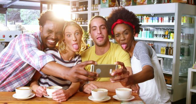 Friends making funny faces while taking a selfie in cafe 4k - Download Free Stock Photos Pikwizard.com