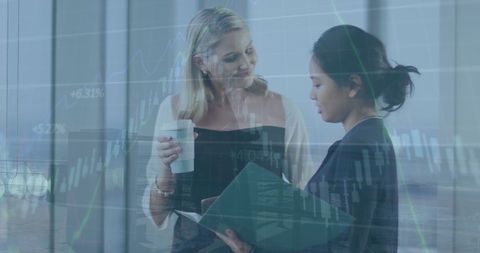 Diverse Businesswomen Analyzing Financial Data Visualization