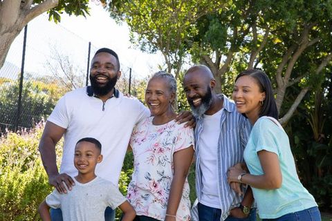 Diverse Family Sharing Moments in Sunny Backyard