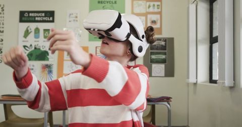 Girl engaging with vr headset in eco-friendly classroom