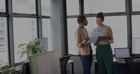 Two Businesswomen Analyzing Reports in Modern Office - Download Free Stock Images Pikwizard.com