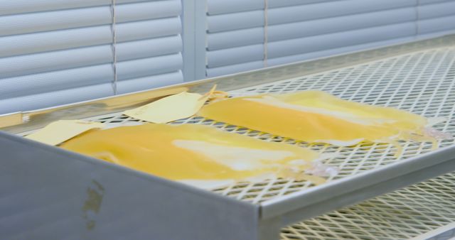 Close up of two yellow blood bags lying on metal shelf in lab - Download Free Stock Photos Pikwizard.com
