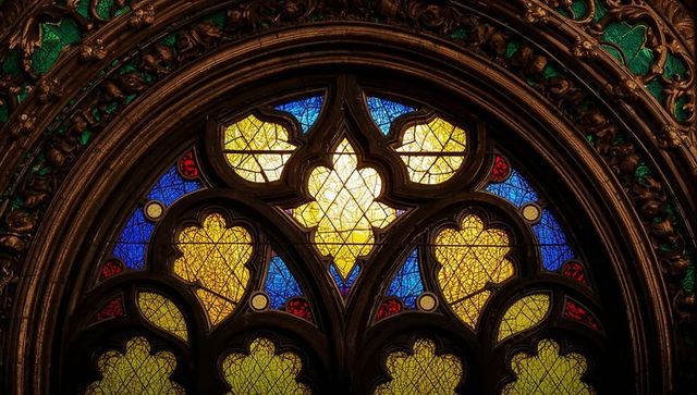Gothic stained glass window illuminations with lead tracery