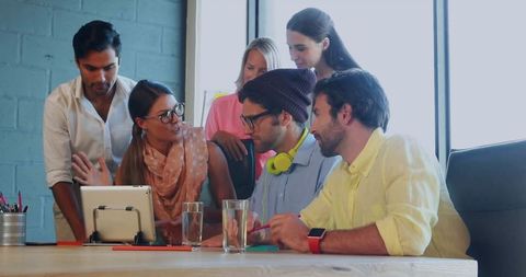 Business Team Collaborating on Project with Digital Tablet