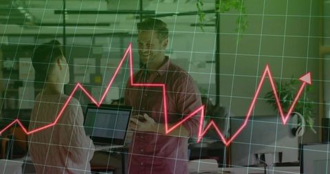 Business Colleagues Analyzing Red Graph in Modern Office