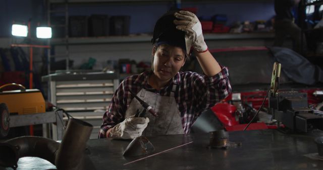 Female Welder Taking a Break in Workshop - Download Free Stock Images Pikwizard.com