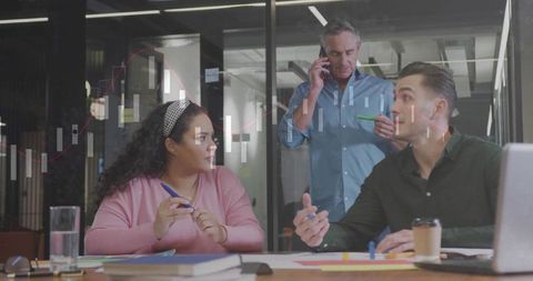 Team Collaboration in a Modern Office With Data Charts