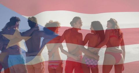 Friends linking arms on beach celebrating summer vacation with puerto rican flag overlay