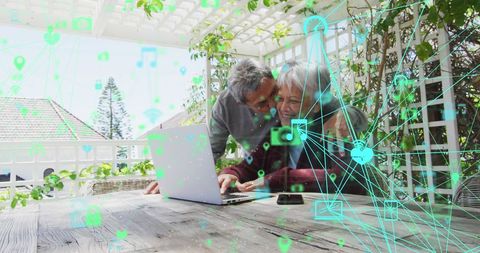 Senior Couple Embraces Digital Technology in Cozy Home