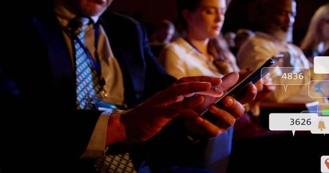 Businessman Using Smartphone in Conference with Notifications Overlay