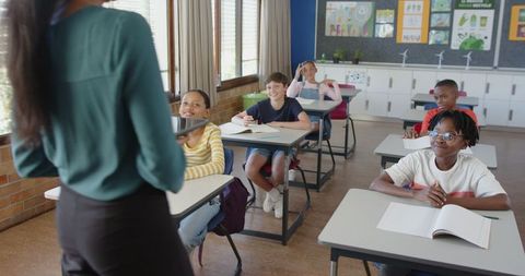 Engaged Students Listening Attentively to Teacher in Classroom