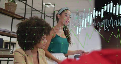 Diverse Colleagues Discussing Finances in Modern Office Setting