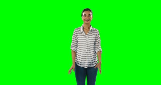 Perfect for overlaying graphics onto the green screen, promotional materials, advertisements, video editing projects requiring professional models, tutorials on green screen use, or stock photos emphasizing happiness and casual fashion.