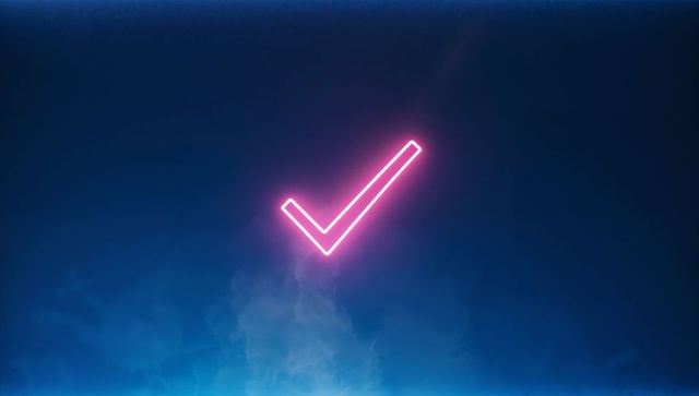 Neon pink checkmark emitting glow over deep blue background