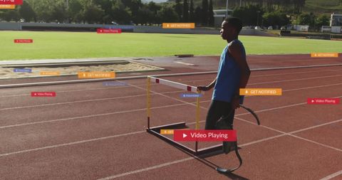 Athlete with Disability Receiving Social Media Notifications on Track