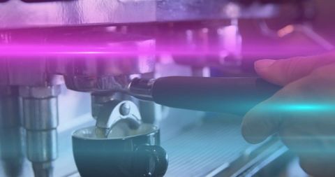 Barista Brewing Coffee in Espresso Machine with Neon Purple and Blue Lights