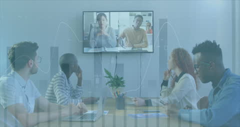 Business Team Meeting with Financial Data Projection