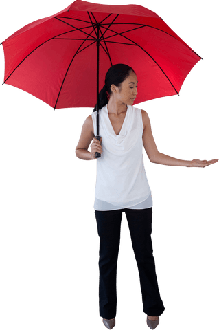 Transparent red umbrella held by woman in white top