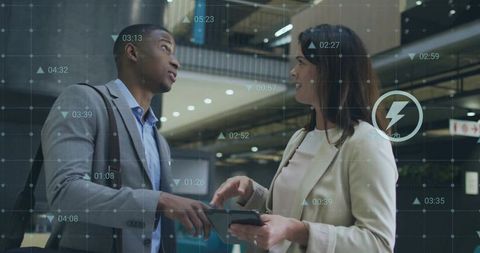 Colleagues Analyzing Data Solutions in Modern Corporate Environment