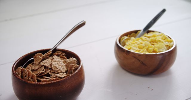 Two Bowls of Cereal on Table with Spoons - Download Free Stock Images Pikwizard.com