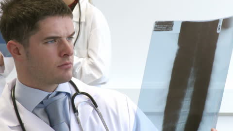 Doctor Analyzing X-Ray in Hospital Environment