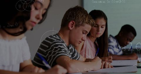 Students Focused on Classroom Lessons with Math Graphics Overlay - Download Free Stock Images Pikwizard.com