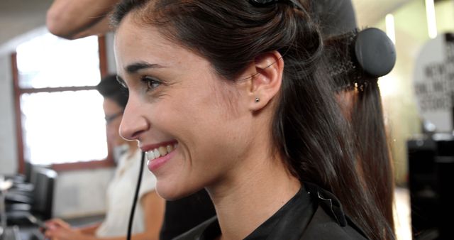 Woman Smiling While Getting Hair Styled at Salon - Download Free Stock Images Pikwizard.com