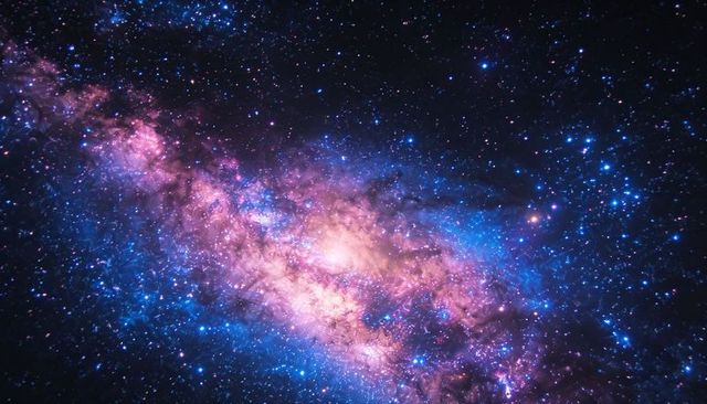 Glowing Galactic Core with Magenta and Blue Nebula Gas Stretching Across Starfield