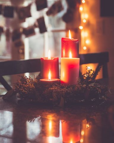 Festive Candles with Warm Glow on Holiday Table Setting