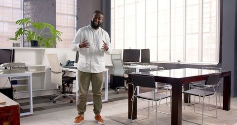 Business Professional Standing Confidently in Contemporary Office