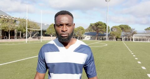 Confident African American Man on Football Field