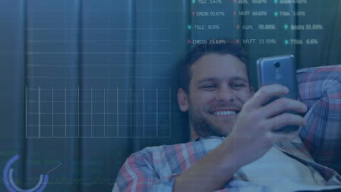 Happy Man Using Smartphone with Digital Stock Data Graphs Overlay
