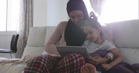 Mother and Daughter Sharing Moments in Cozy Living Room