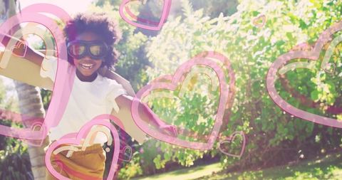 Joyful Boy with Cardboard Wings Dreaming of Flight Outdoors