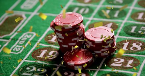 Celebratory confetti over winning roulette chips