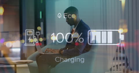 Businessman Utilizing Laptop with Charging Animation Overlay