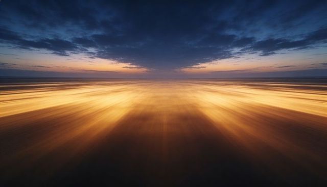 Golden sunrise motion on wet sand creating radiant streaks toward cloudy horizon