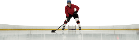 Transparent hockey player in action at ice rink