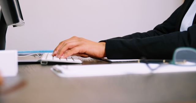 Businessperson Typing on Keyboard in Office Environment - Download Free Stock Images Pikwizard.com