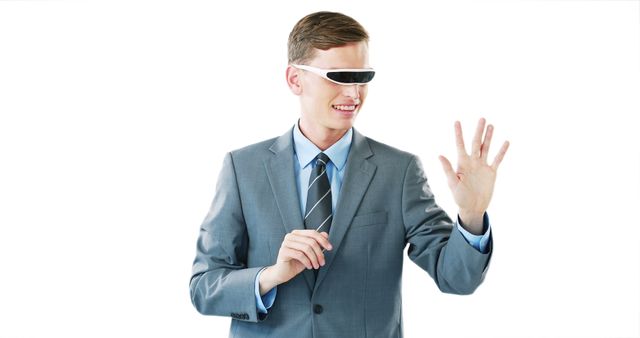 Young Professional Man Using Virtual Reality Glasses Against White Background - Download Free Stock Images Pikwizard.com