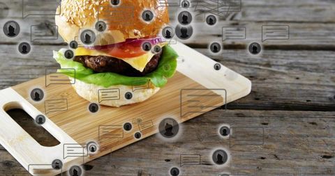 Cheeseburger on rustic cutting board with social chat overlay for food review marketing