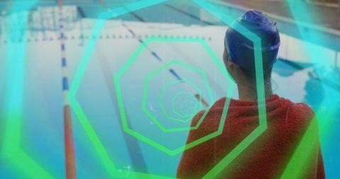 Standing swimmer wearing blue cap at pool edge with neon hexagon overlay